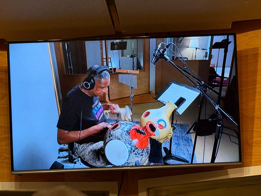 The control-room monitor showing Ronnie Burrage at the clay pot drums.