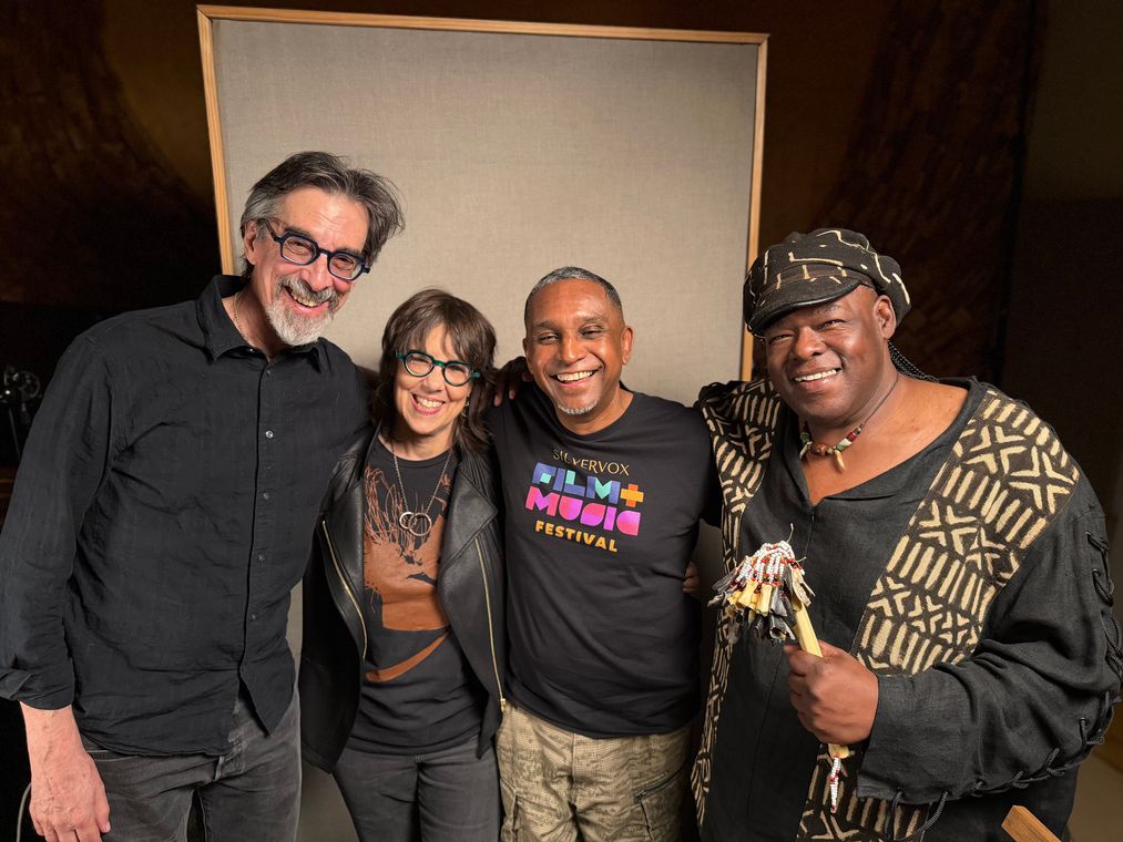 Ritt Henn, Beth Falcone, Ronnie Burrage and Roosevelt Andr&eacute; Credit in the studio, Roosevelt holding a beaded shaker.