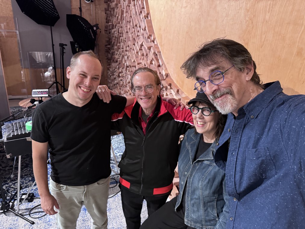 Rex Benincasa, Beth Falcone, and Ritt Henn with a collaborator in the studio.